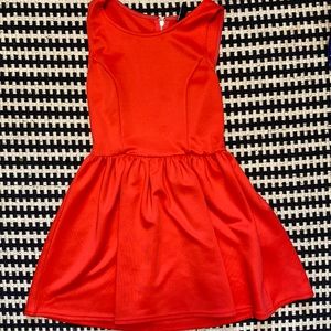 a super cute red cocktail dress. size small. just above the knee.